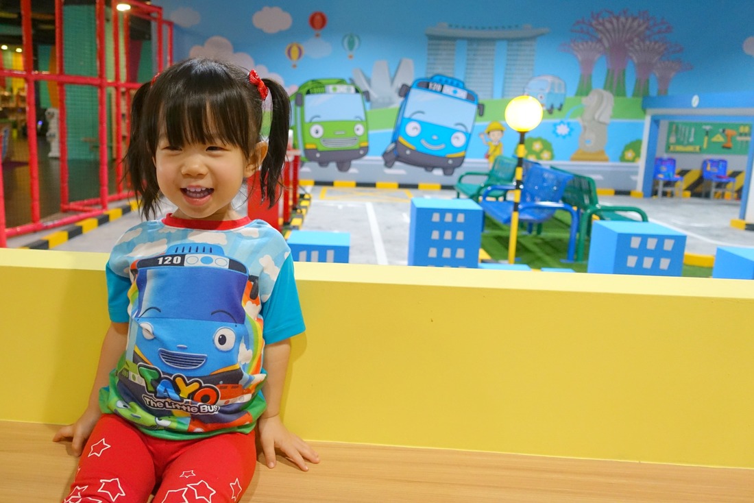 Love Mae's smile here! The sitting area overlooks the road safety circuit. Can you see the wall mural which features the Merlion, the Art Science Museum, Marina Bay Sands Hotel and the Supertree Grove at Gardens by the Bay?