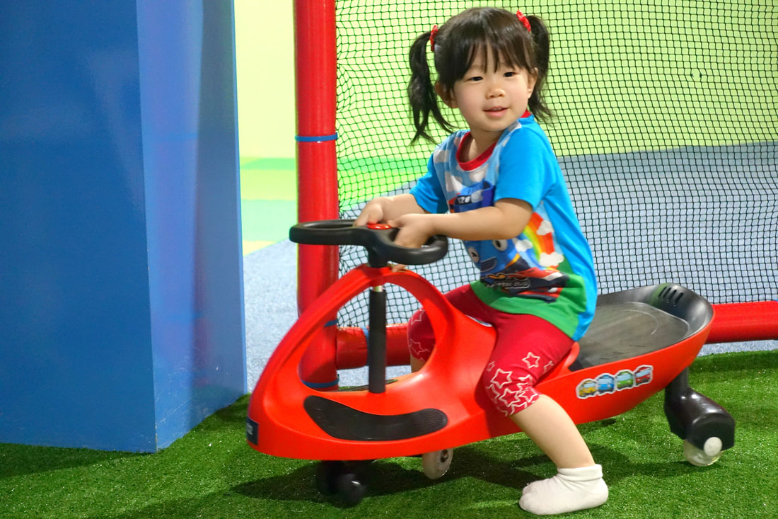 A red twist car to match Mae's outfit. She had so much fun on the driving circuit! 