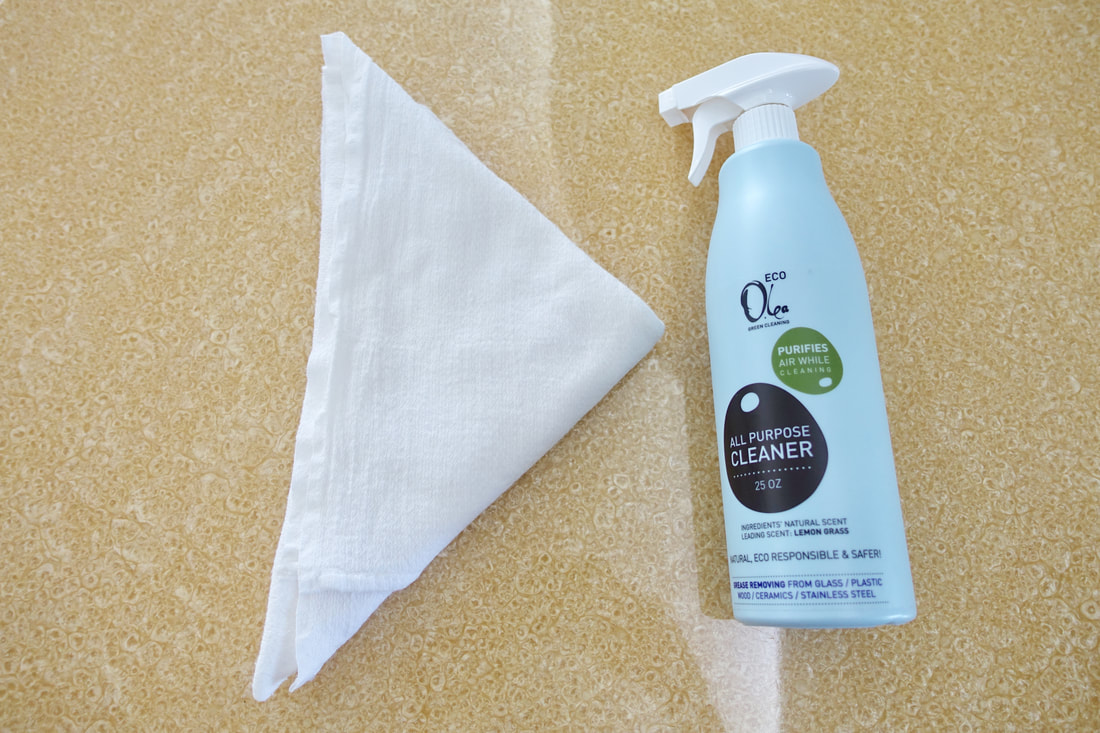 Our chosen tools to clean the dining table: a cloth and the Olea Essence Eco All-Purpose Cleaner!