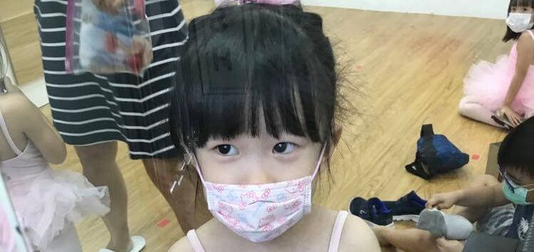 Maeleth after ballet class wearing her kids face mask.